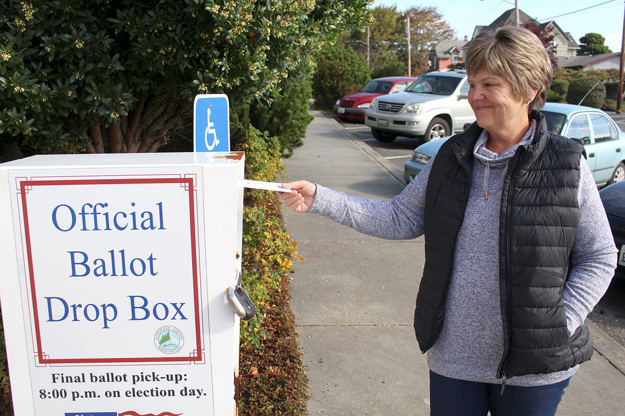 Cindy Rice of Port Ludlow drops off her ballot for the Nov. 3 general election Thursday, Oct. 22, 2020, at the walk-up drop box in front of the Jefferson County Courthouse. (Zach Jablonski/Peninsula Daily News)