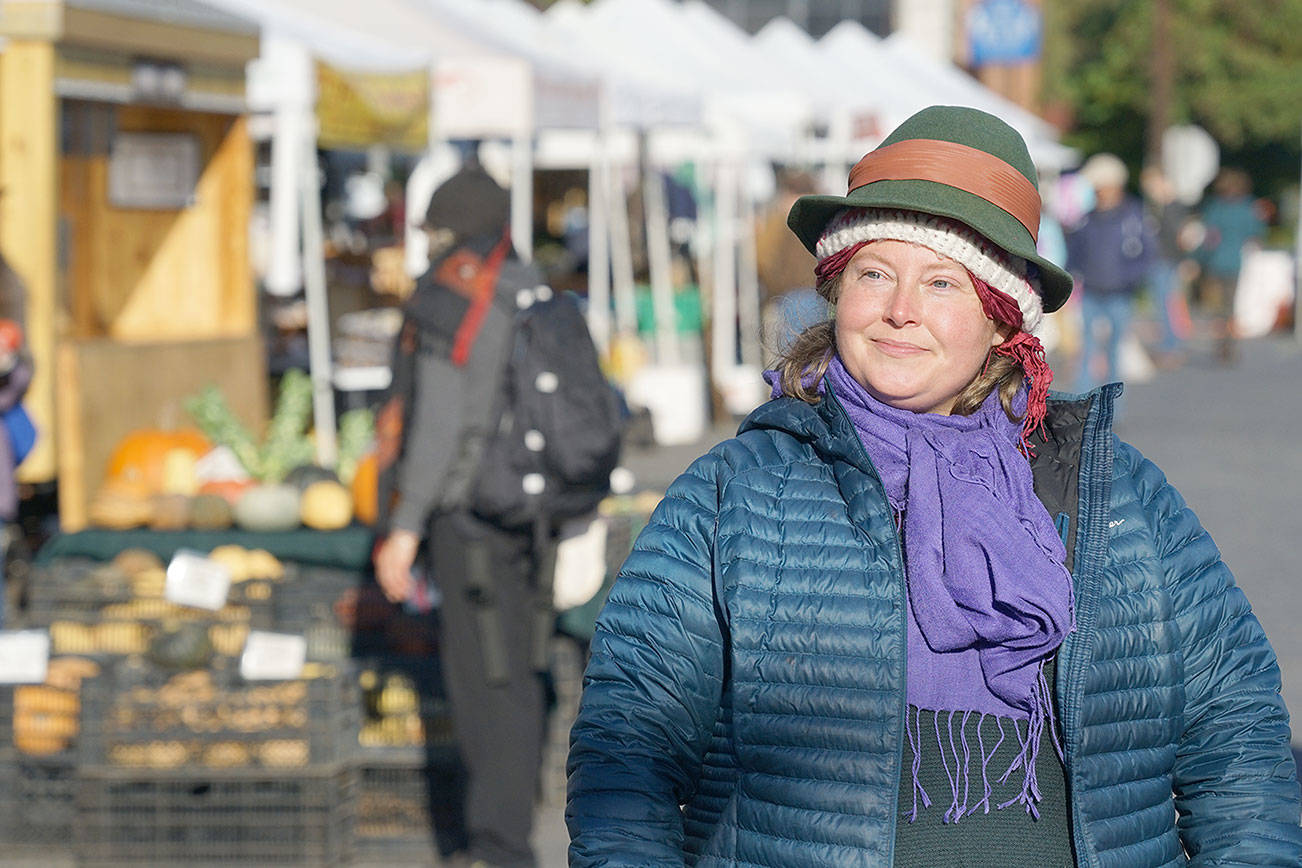 (4013): Deirdre Morrison takes in the bustling energy of the PortTownsend Farmers Market on Saturday in uptown Port Townsend. The39-year-old is the new market manager for the Jefferson County FarmersMarkets. Nicholas Johnson/Peninsula Daily News