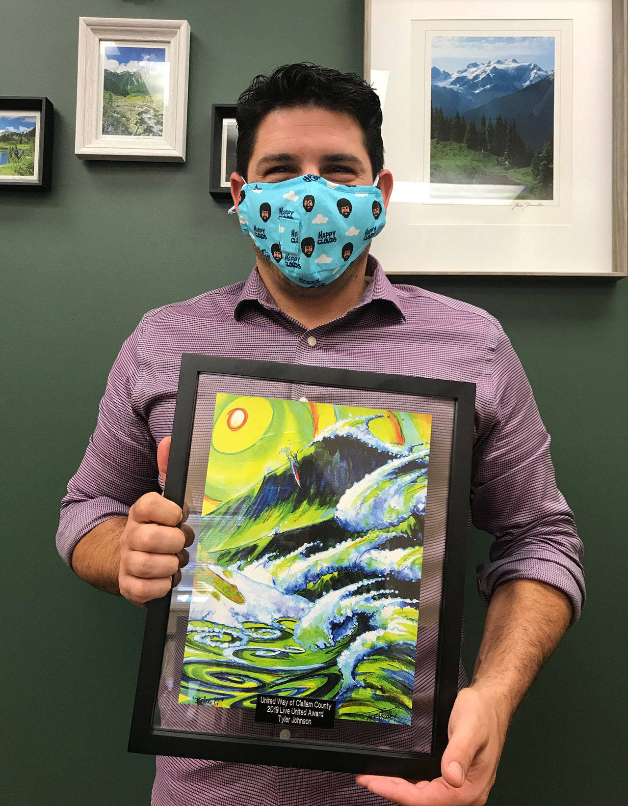 Tyler Johnson displays his United Way of Clallam County Live United award that features the artwork of Todd Fischer.The 2019 campaign chair, Johnson went above and beyond to help United Way reach the campaign goal, the organization said.