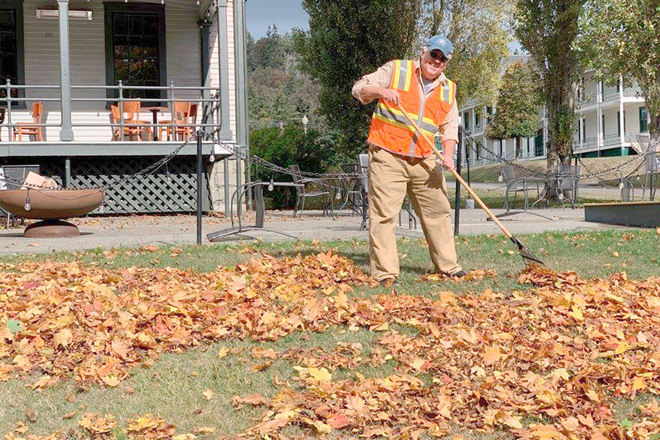 Todd Blankenship, Jefferson Community Conservation Corps' first hired worker, rakes leaves at Fort Worden State Park. His position was funded by donations raised by the JCCC and he works for the Fort Worden Public Development Authority. (Jefferson Community Conservation Corps)