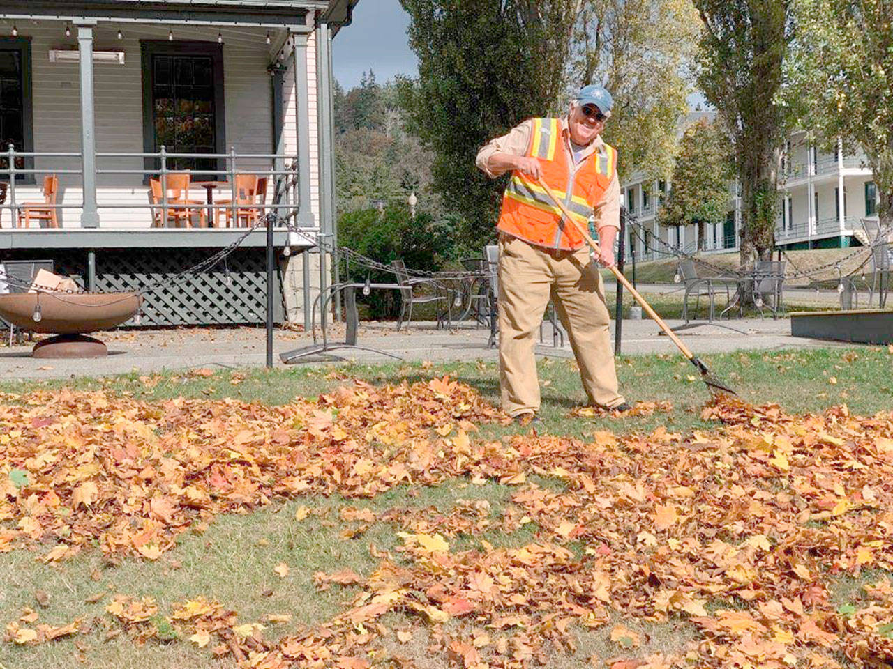 Todd Blankenship, Jefferson Community Conservation Corps’ first hired worker, rakes leaves at Fort Worden State Park. His position was funded by donations raised by the JCCC and he works for the Fort Worden Public Development Authority. (Photo courtesy of Jefferson Community Conservation Corps)