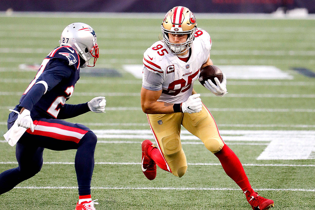 San Francisco 49ers tight end George Kittle runs the ball after a catch against the New England Patriots at Gillette Stadium Oct. 25 in Foxborough, Mass. (Winslow Townson/Associated Press Images)