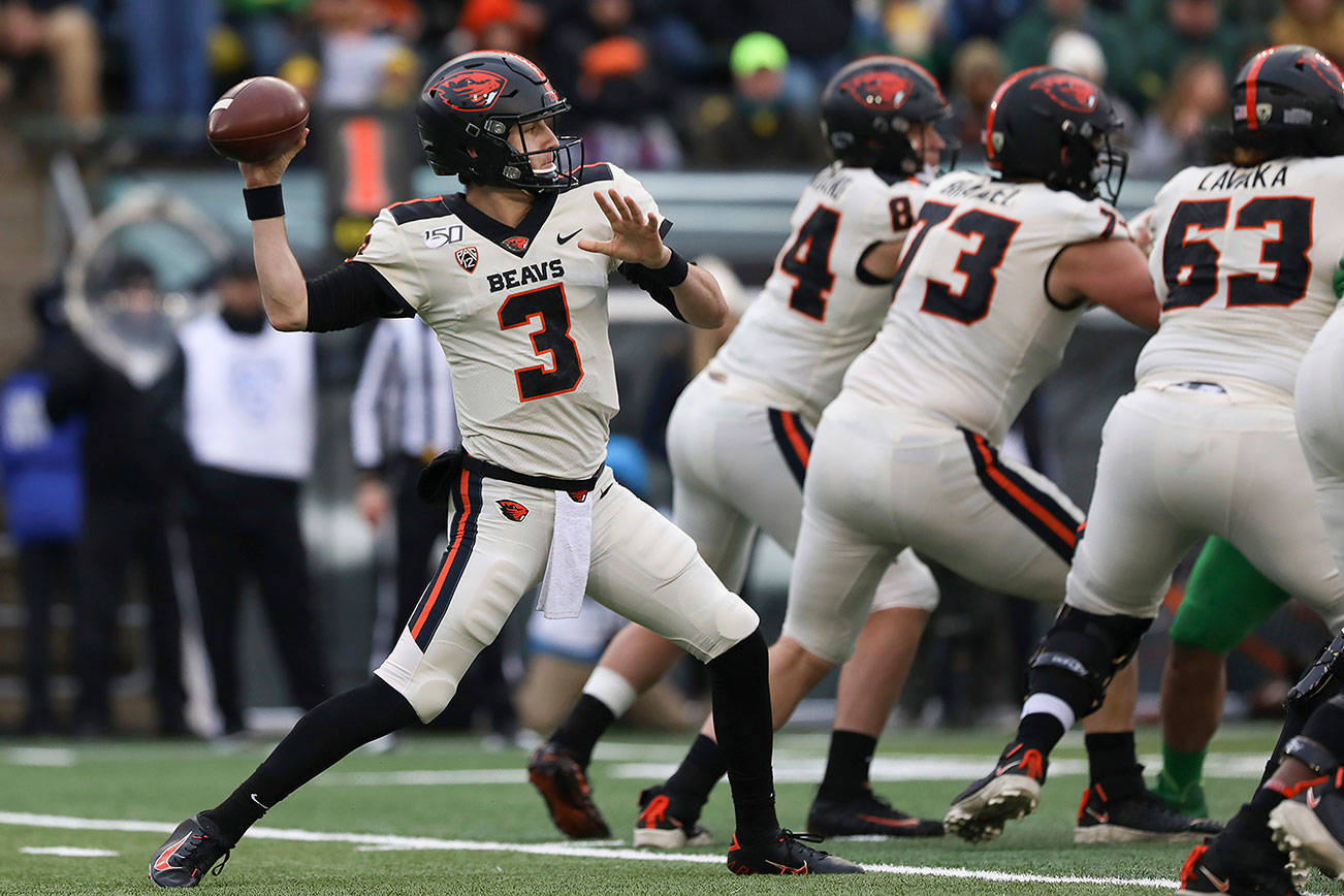 FILE - In this Nov. 30, 2019, file photo, Oregon State quarterback Tristan Gebbia (3) throws a pass during the second half of an NCAA college football game against Oregon in Eugene, Ore. The uncertainty for the Beavers is centered on the offense. Quarterback Jake Luton has moved on to the Jacksonville Jaguars and Gebbia, at least for now, looks like the frontrunner going into the abbreviated season. (AP Photo/Amanda Loman, File)