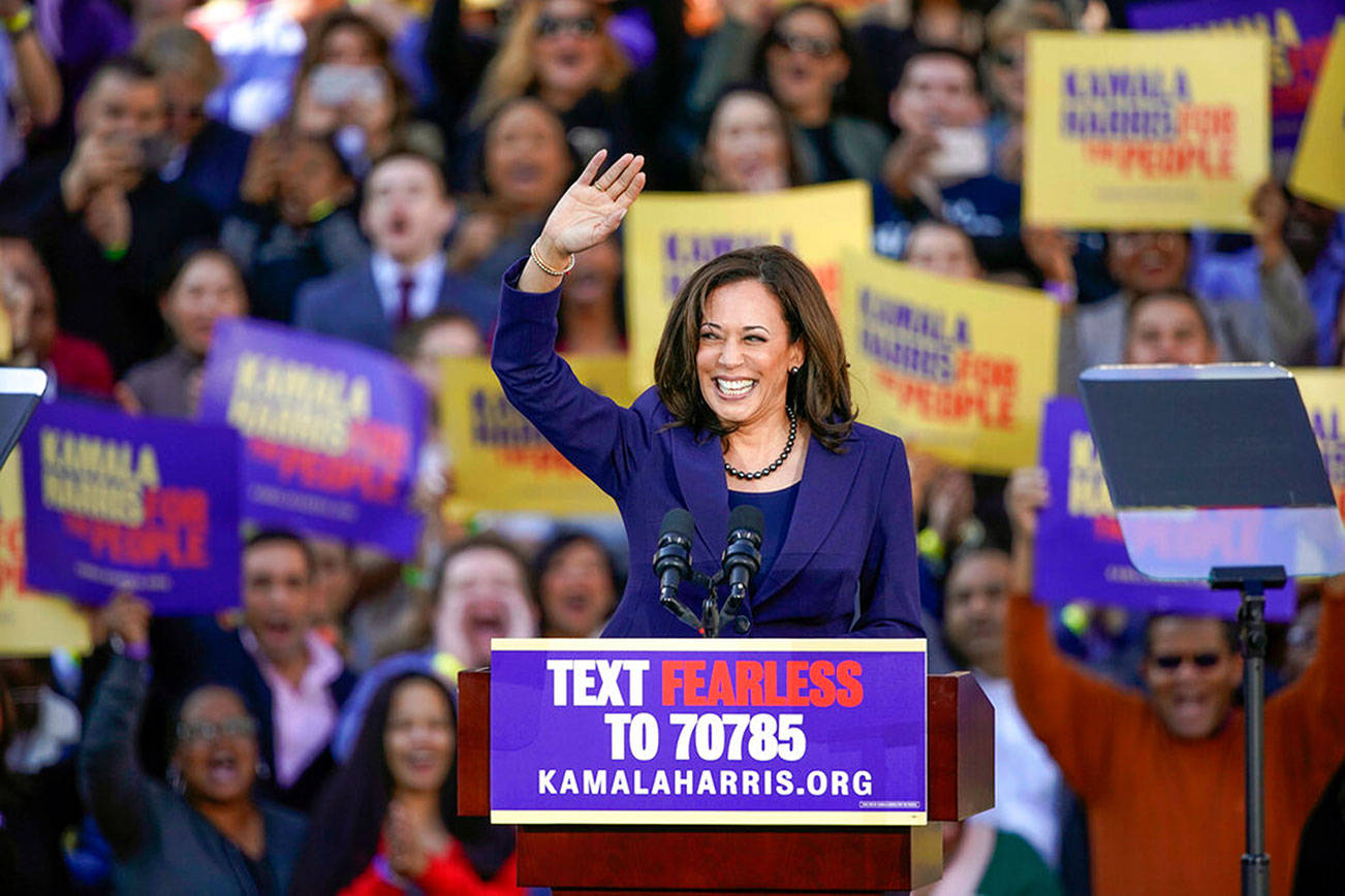 FILE - In this Jan. 27, 2019, file photo, Democratic Sen. Kamala Harris, of California, waves to the crowd as she formally launches her presidential campaign at a rally in her hometown of Oakland, Calif. Harris made history Saturday, Nov. 7,  as the first Black woman elected as vice president of the United States, shattering barriers that have kept men — almost all of them white — entrenched at the highest levels of American politics for more than two centuries. (AP Photo/Tony Avelar, File)