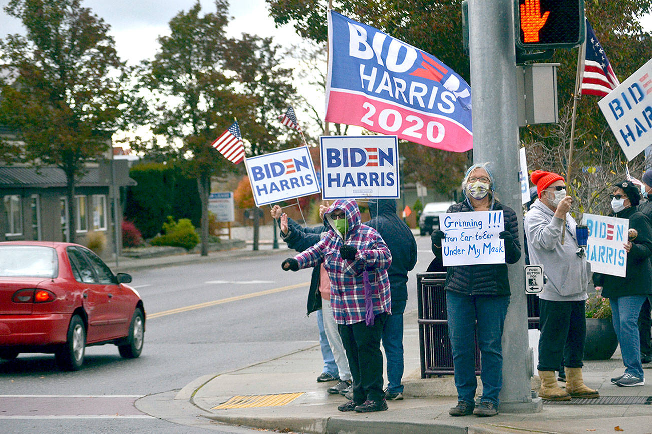 About 30 Sequim residents gathered at the northeast corner of Sequim Avenue and Washington Street on Saturday to show their support for the election of Joe Biden and Kamala Harris as president and vice-president. Matthew Nash/ Olympic Peninsula News Group