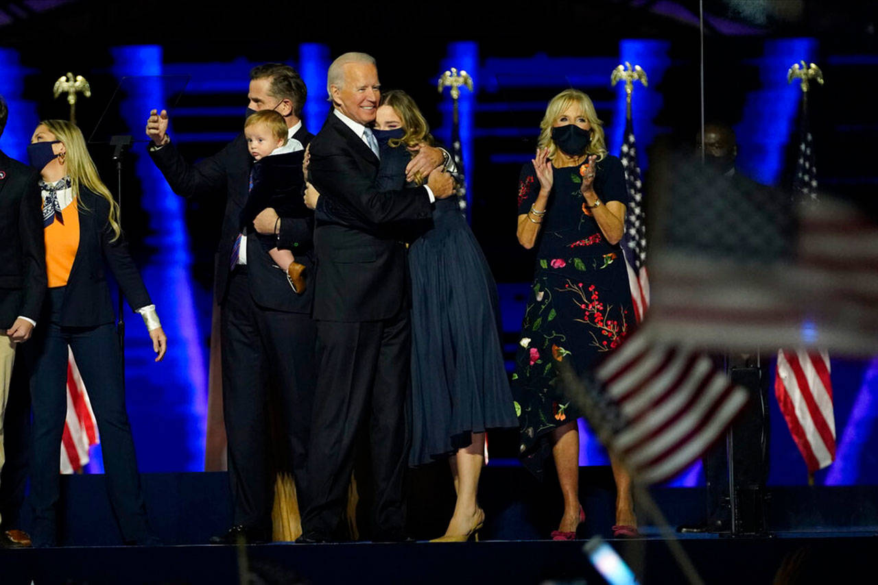President-elect Joe Biden, cente, with his wife Jill Biden and members of this family on stage Saturday, Nov. 7, 2020, in Wilmington, Del. (Andrew Harnik/Associated Press/Pool)