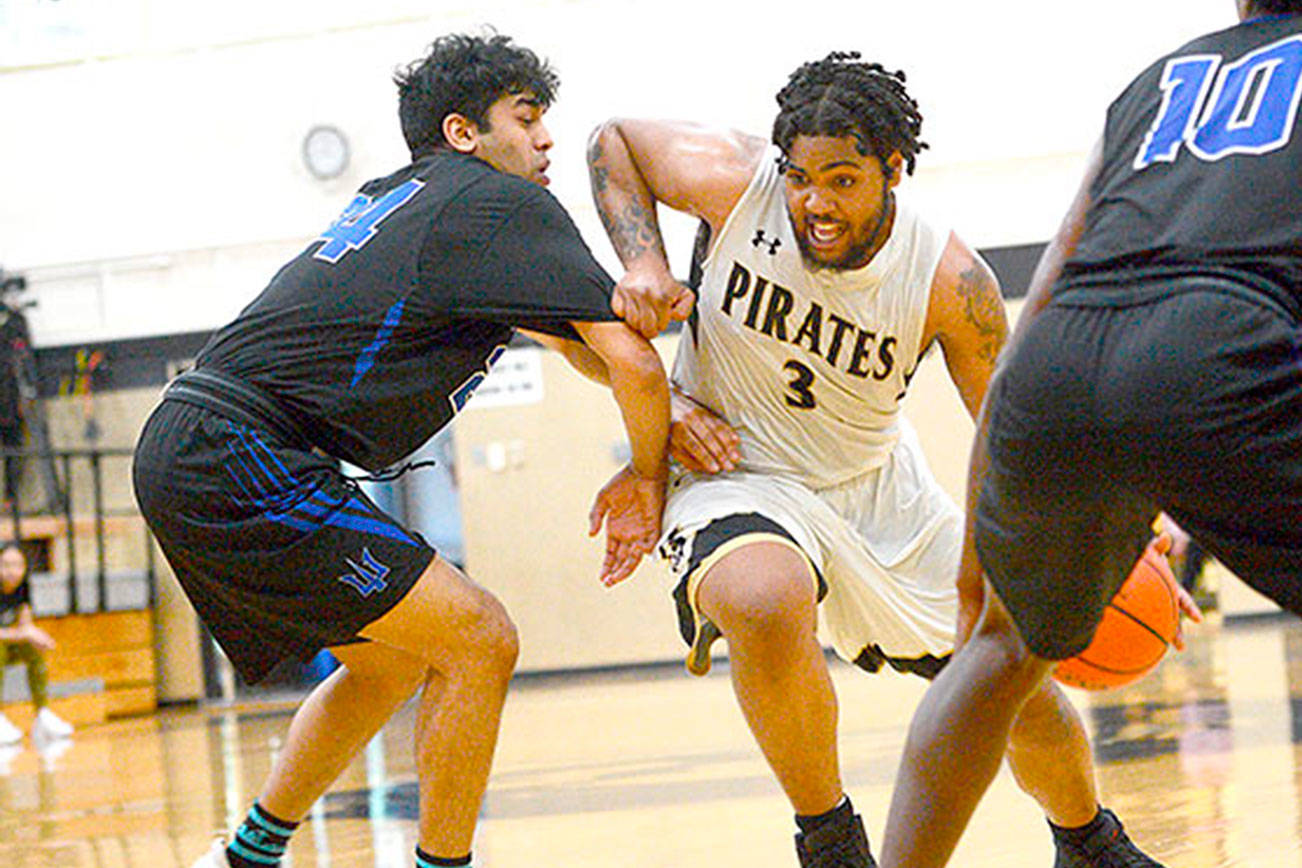 Peninsula College's Davien Harris-Williams drives against Edmonds on Saturday night. Harris-Williams scored 34 points to help lead the Pirates to a 111-98 win over the Tritons to qualify for the NWAC Tournament. (Jesse Major/for Peninsula Daily News)