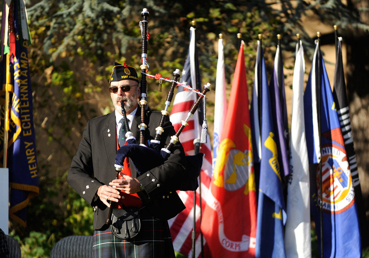 Bagpiper Rick McKenzie plays for the crowd at a Veterans Day ceremony at Pioneer Memorial Park in Sequim on Wednesday. (Michael Dashiell/Olympic Peninsula News Group)