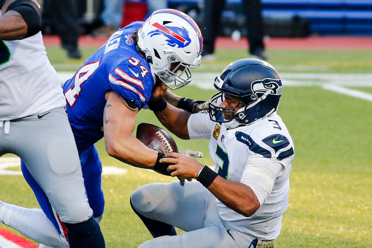 Buffalo Bills' A.J. Klein (54) strip sacks Seattle Seahawks quarterback Russell Wilson (3) during the second half of an NFL football game Sunday, Nov. 8, 2020, in Orchard Park, N.Y. Klein recovered the ball on the play. (AP Photo/Jeffrey T. Barnes)