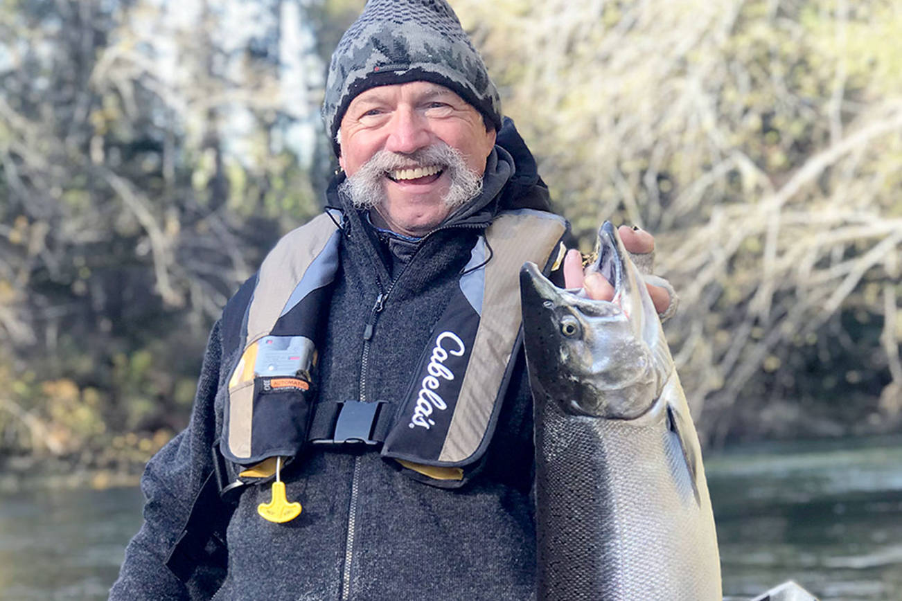 Mike Zavadlov
Judson Henry recently caught this ocean-bright hatchery coho while fishing the Sol Duc River with Mike Zavadlov of Mike Z's Guide Service.