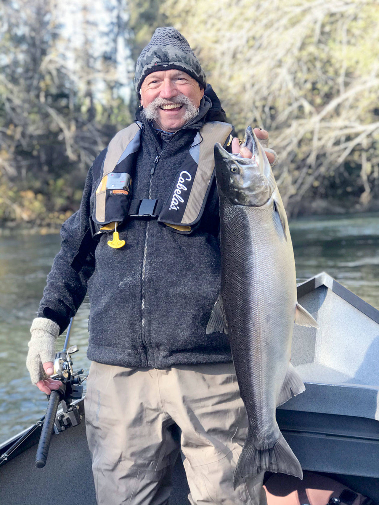Judson Henry recently caught this ocean-bright hatchery coho while fishing the Sol Duc River with Mike Zavadlov of Mike Z’s Guide Service. (Photo courtesy of Mike Zavadlov)