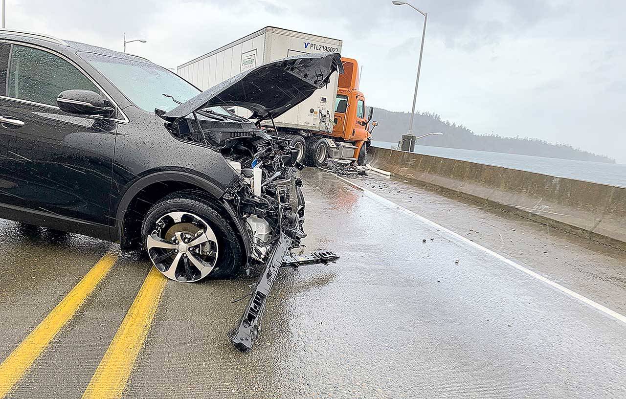 A head-on collision between a car and semi-truck closed the Hood Canal Bridge in both directions for nearly two hours on Tuesday morning. (State Patrol)