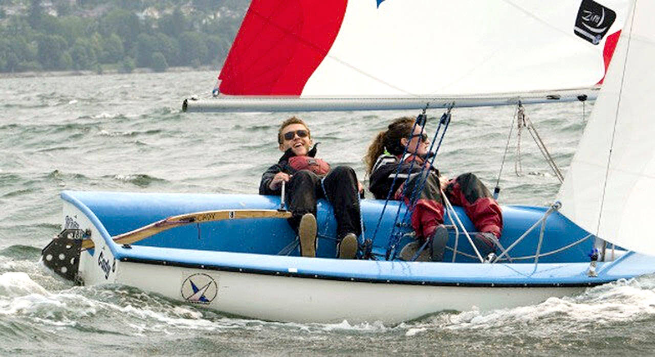 From left, Cedric Wesley Keneipp and Mallory Hood, both of Bellingham, sail in Bellingham Bay. They are part of Barely Legal Racing, a team of 19- to 22-year-olds that plan to compete in the Race to Alaska in 2021.