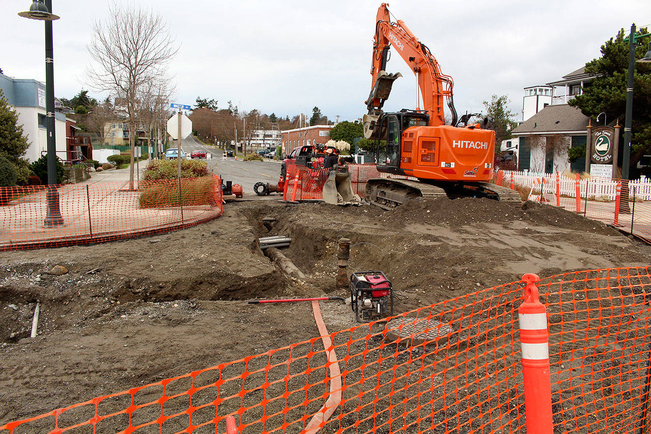 Teams from Seton Construction and Port Townsend Public Works continued their work of fixing a broken water main on Wednesday after the pipe burst on Monday night. (Zach Jablonski/Peninsula Daily News)