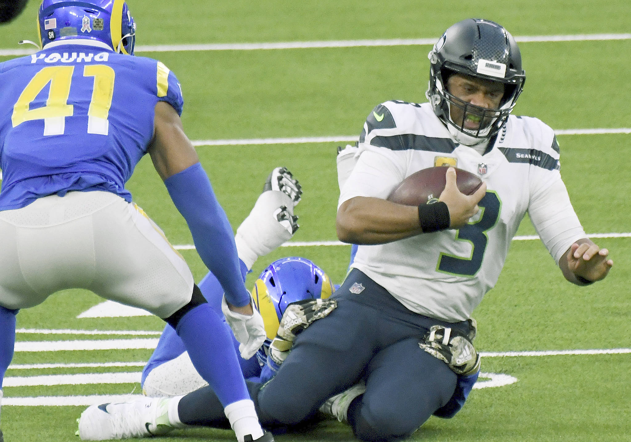 Seattle Seahawks quarterback Russell Wilson (3) scrambles against the Los Angeles Rams in the fourth quarter of an NFL football game in Inglewood, Calif., Sunday, Nov. 15, 2020. (Keith Birmingham/The Orange County Register via AP)