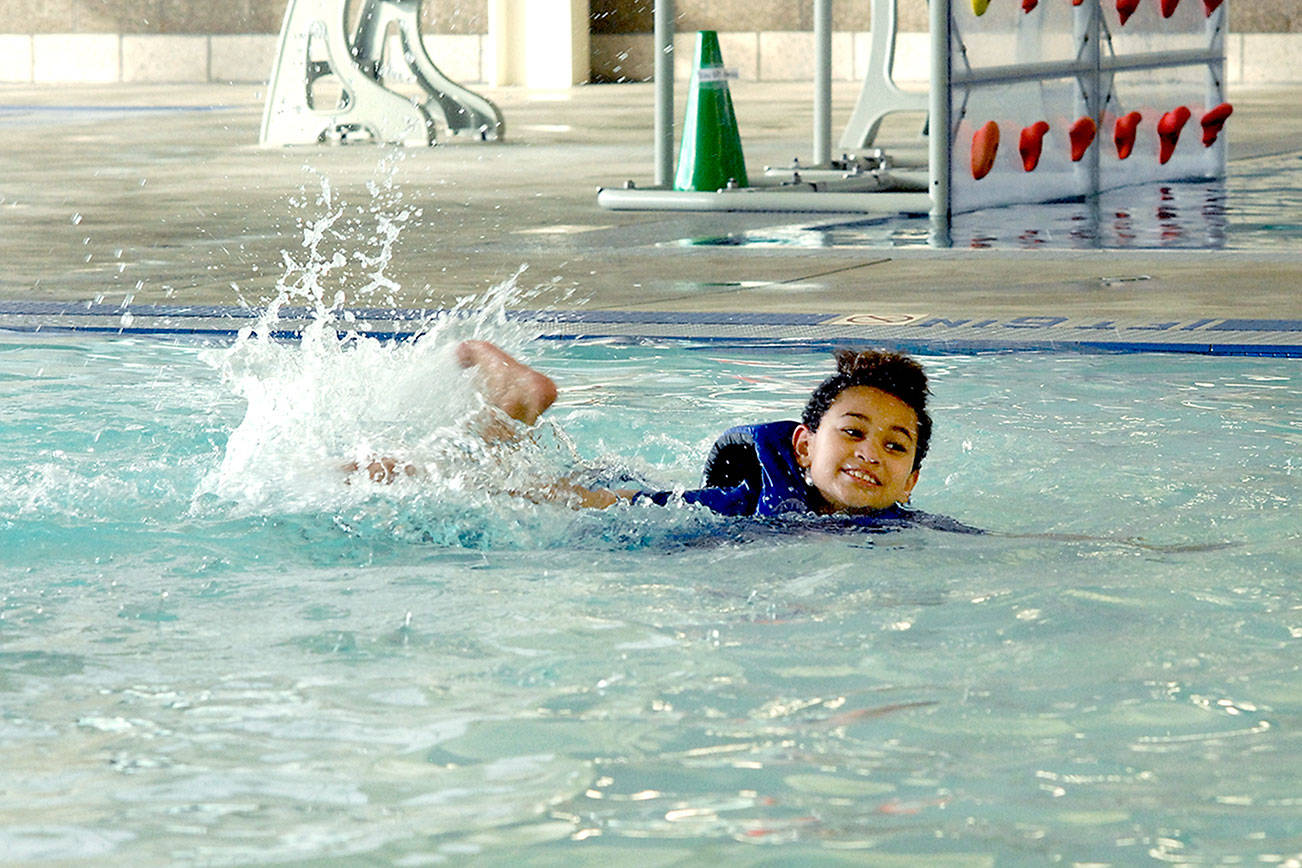 Jasper Cummins, 8, of Port Angeles practices his swimming skills on Saturday at the Shore Aquatic Center in Port Angeles. (Keith Thorpe/Peninsula Daily News)