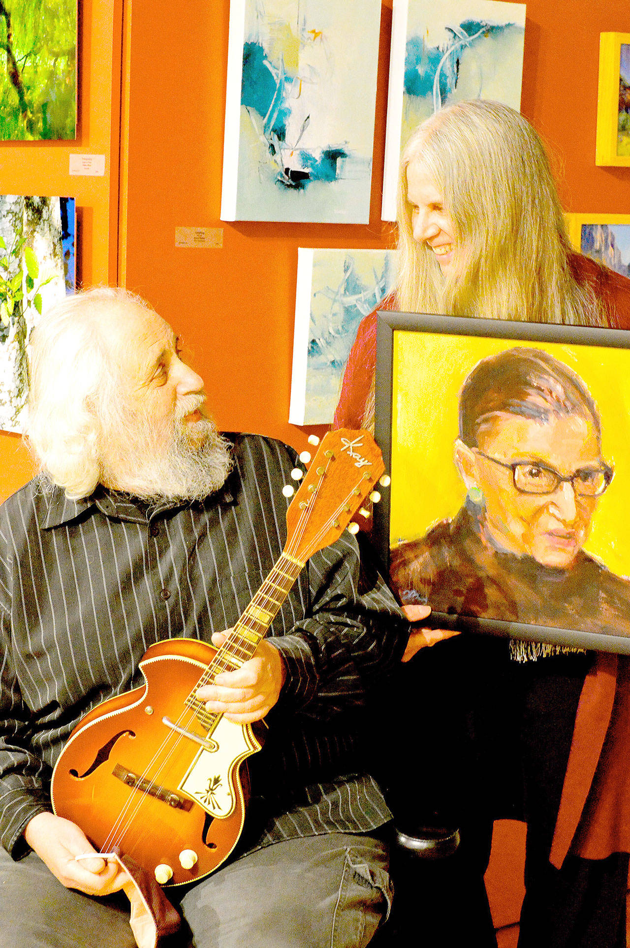 Mandolinist David Grisman and painter Tracy Bigelow Grisman, seen here with their donations, are among the contributors to “Weave It Together,” the Northwind Arts Center-Port Townsend School of the Arts auction online now. (Diane Urbani de la Paz/Peninsula Daily News)