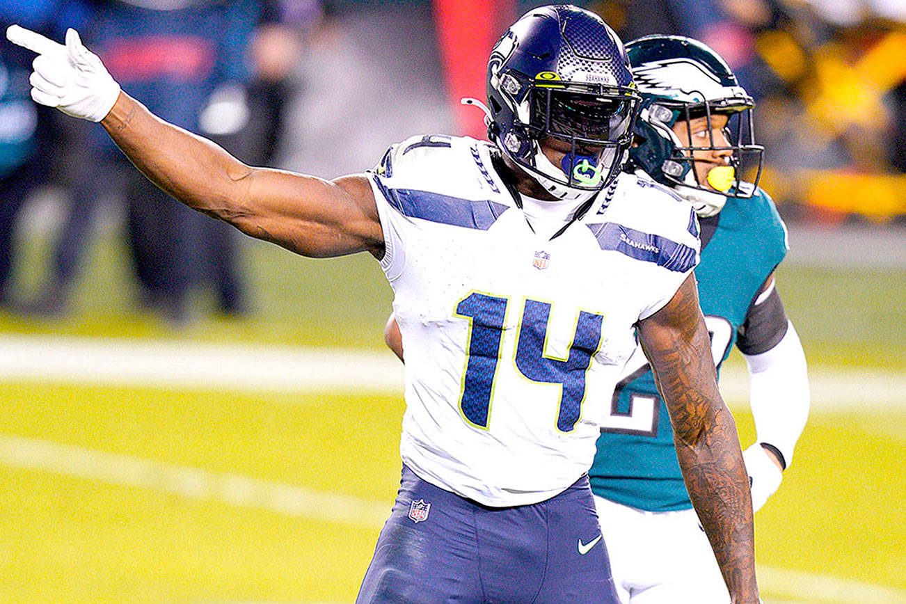 Seattle Seahawks' DK Metcalf reacts after a first down catch during the first half of an NFL football game against the Philadelphia Eagles, Monday, Nov. 30, 2020, in Philadelphia. (AP Photo/Chris Szagola)