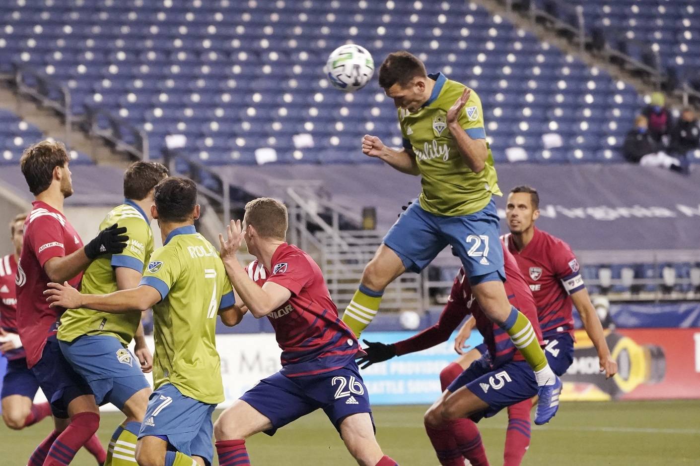 Seattle Sounders defender Shane O’Neill (27) heads in a goal against FC Dallas during the second half of an MLS playoff soccer match, Tuesday in Seattle. (AP Photo/Ted S. Warren)