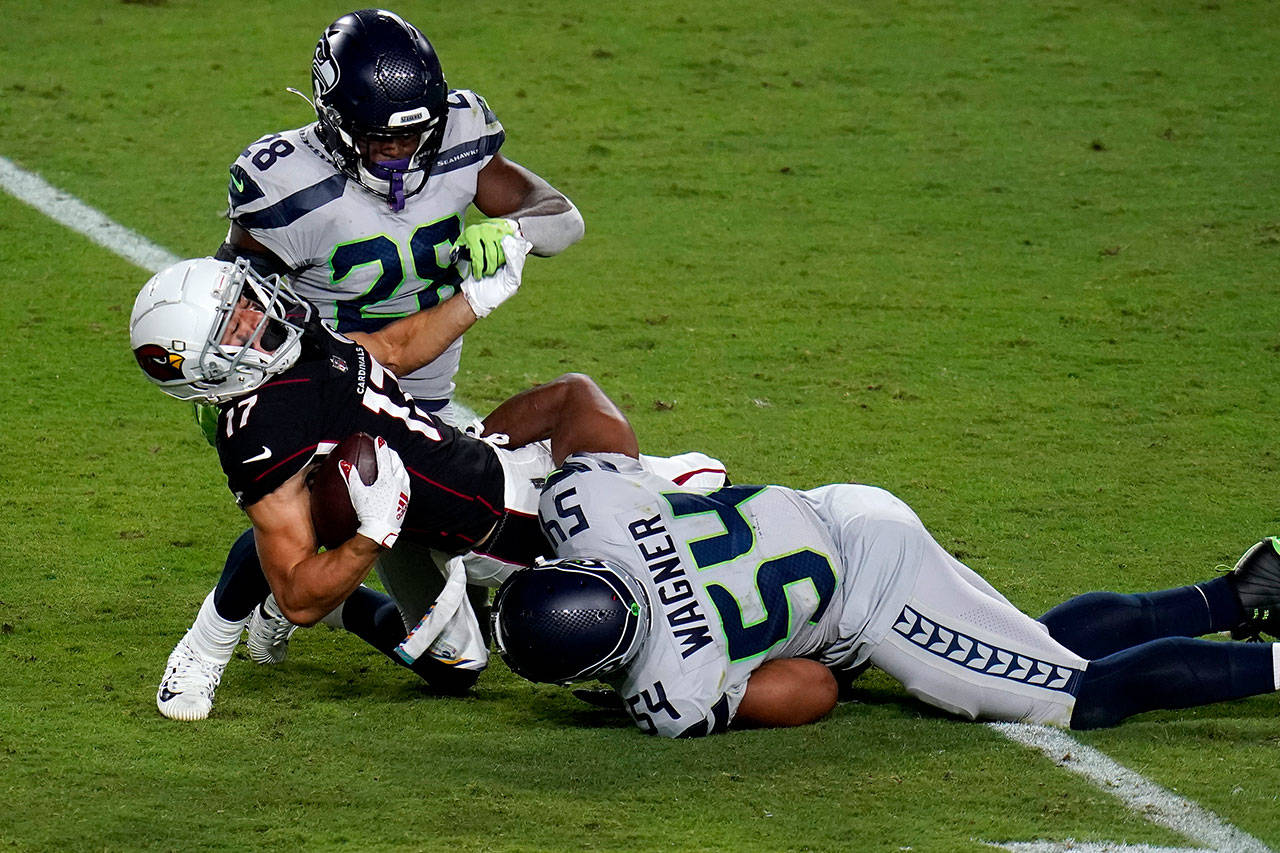 Arizona Cardinals wide receiver Andy Isabella (17) is hit by Seattle Seahawks middle linebacker Bobby Wagner (54) during the second half of an NFL football game Sunday, Oct. 25, 2020, in Glendale, Ariz. (Ross D. Franklin/Associated Press)