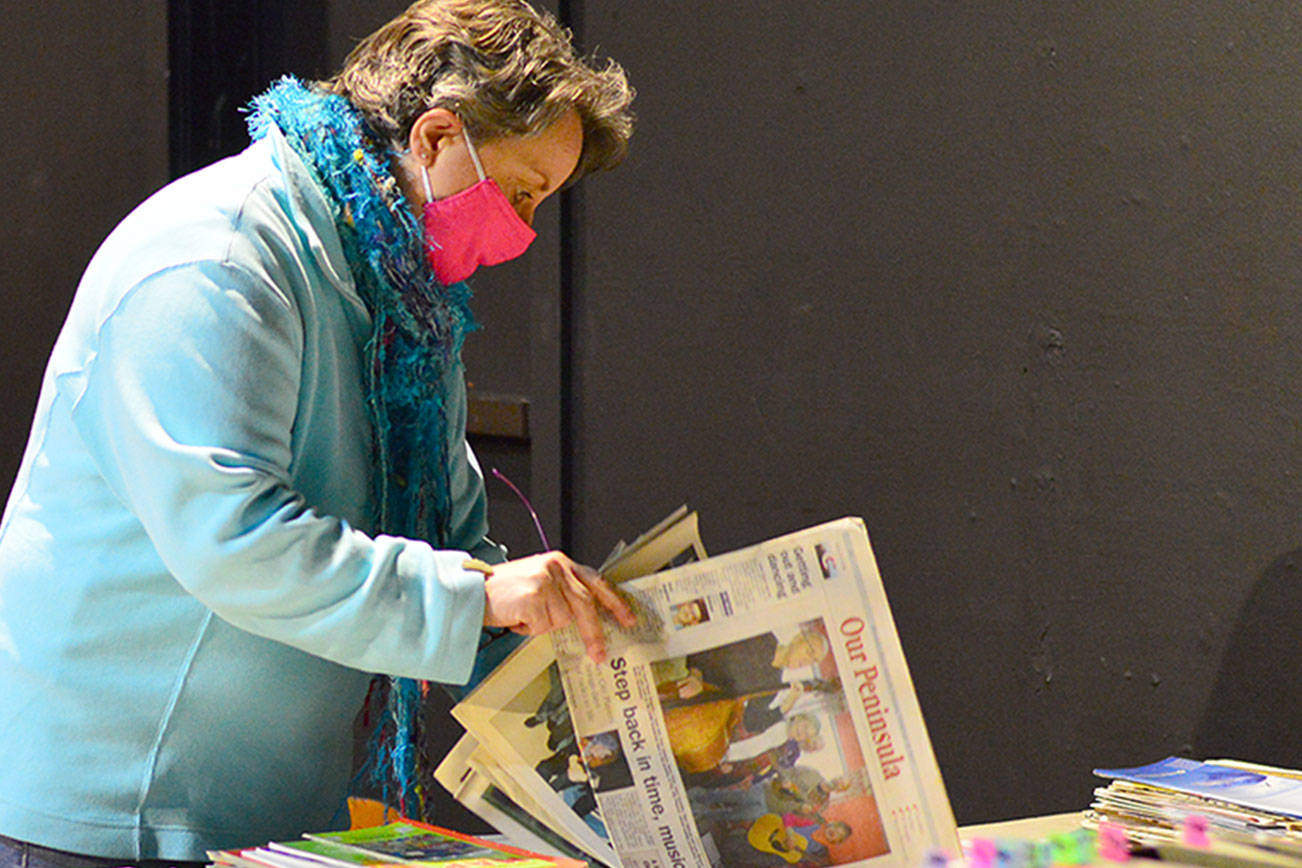 As remodeling begins at Key City Public Theatre, artistic director Denise Winter sorts through the playhouse archives. Diane Urbani de la Paz/Peninsula Daily News