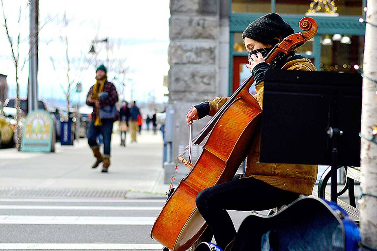 Downtown music making, such as that by cellist Sage Coy, has long been part of Port Townsend's cultural identity. Now, with the state officially naming a Creative District within the city, artists are invited to submit proposals for wayfinding art markers downtown, Uptown and at Fort Worden State Park. (Diane Urbani de la Paz/Peninsula Daily News)