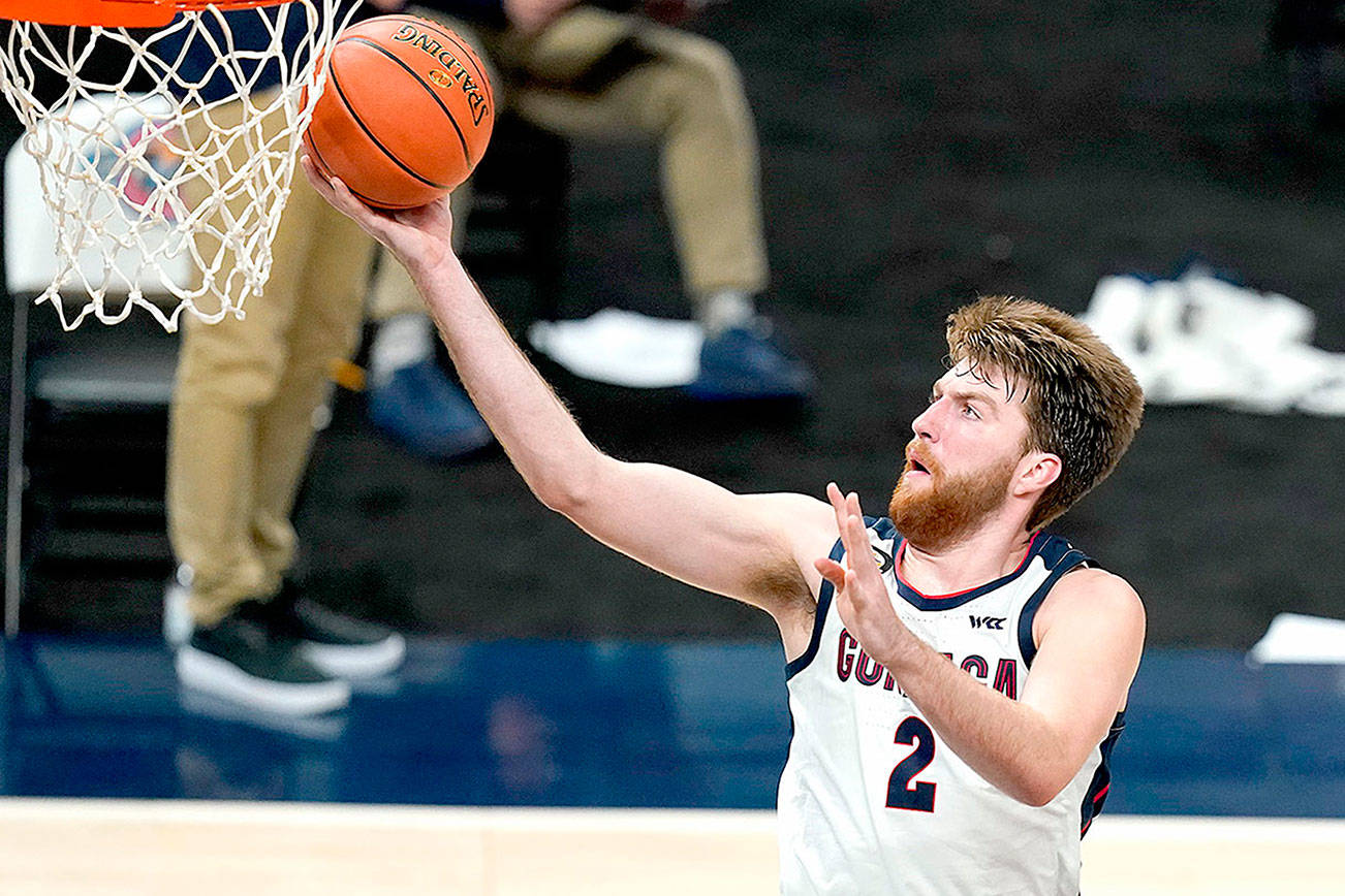 Gonzaga's Drew Timme goes to the basket during the second half of the team's NCAA college basketball game against West Virginia, Wednesday, Dec. 2, 2020, in Indianapolis. (AP Photo/Darron Cummings)