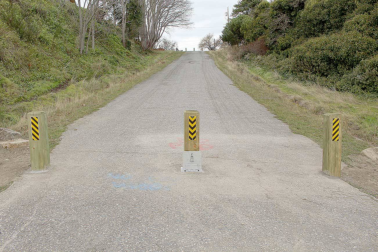 Port Townsend Public Works installed permanent wooden bollards that have replaced the "road closed" signage on Adams Street after the city council voted to keep the street closed. (Zach Jablonski/Peninsula Daily News)