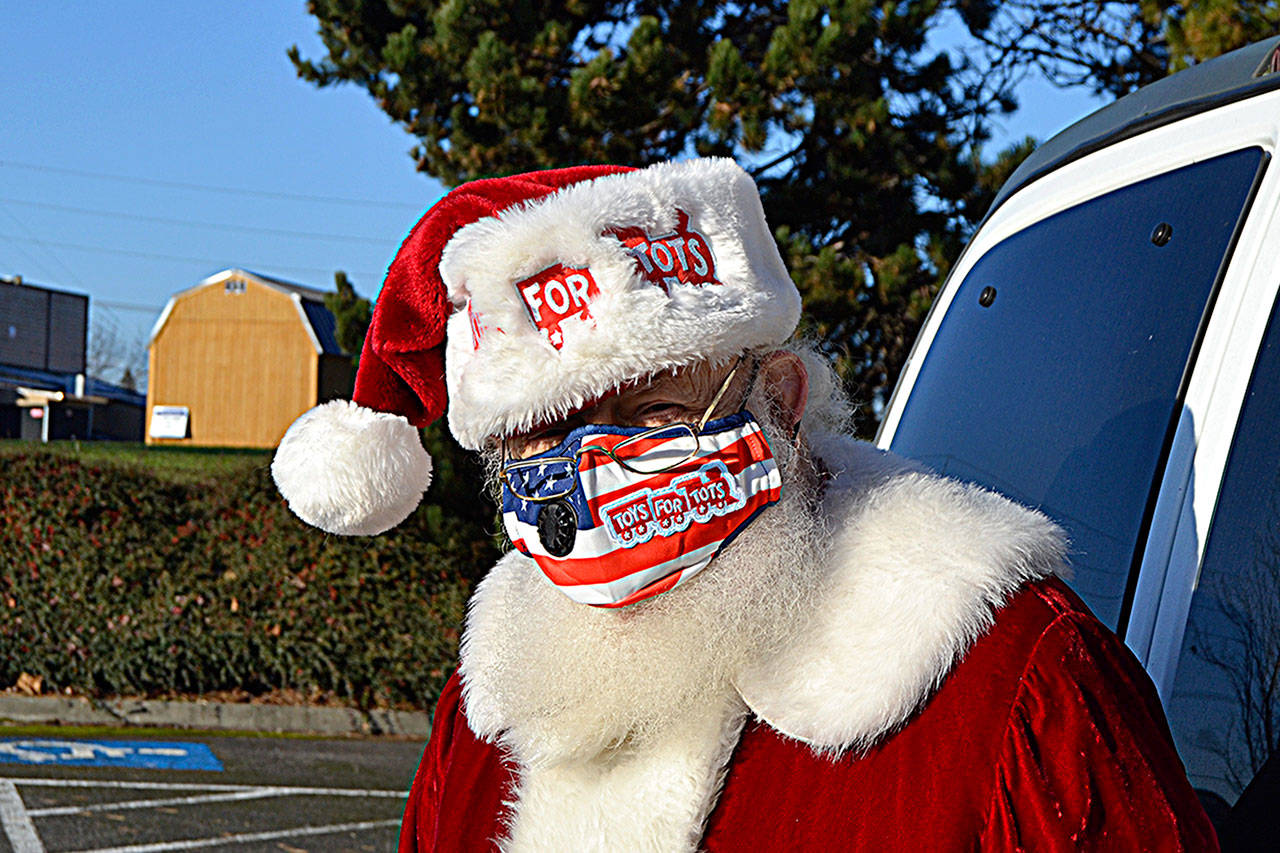 For 50 years, Diamond Point’s Don McIntyre has portrayed Santa Claus to benefit the U.S. Marine Corps Reserve Toys for Tots. While limited this year due to COVID-19, he plans to continue on as Santa for at least another five years. (Matthew Nash/Olympic Peninsula News Group)