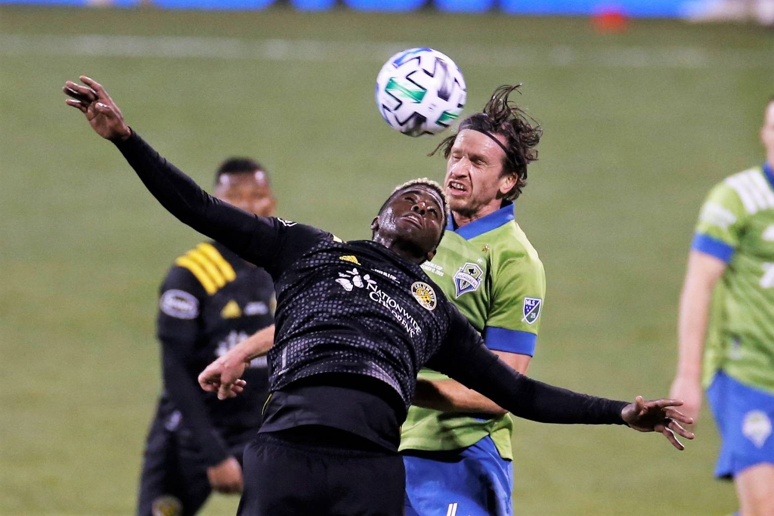 Columbus Crew’s Gyasi Zardes, front, and Seattle Sounders’ Gustav Svensson vie for a head ball during the second half of the MLS Cup championship game Saturday in Columbus, Ohio. The Crew won 3-0. (AP Photo/Jay LaPrete)