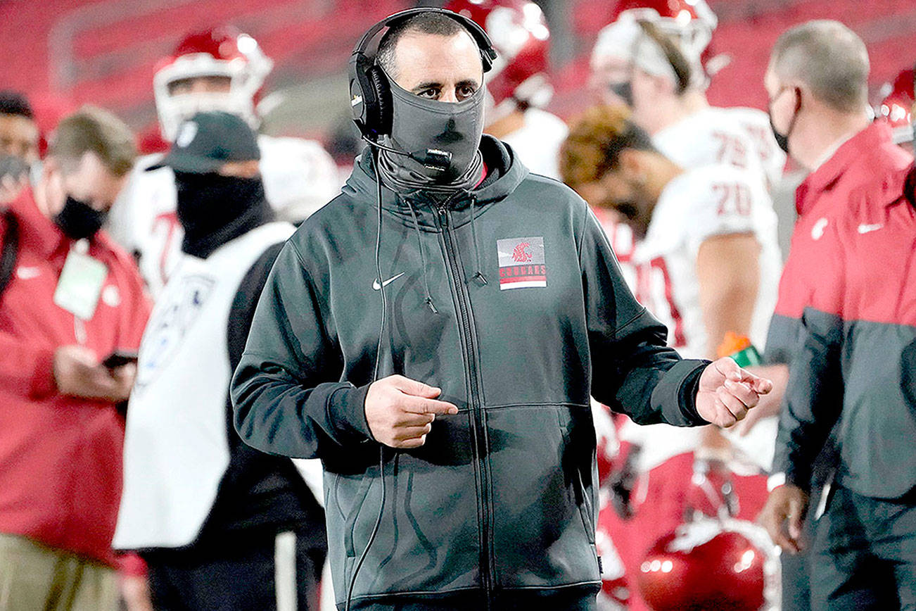 Washington State head coach Nick Rolovich walks the sideline during the second half of an NCAA college football game against Southern California in Los Angeles, Sunday, Dec. 6, 2020. (AP Photo/Alex Gallardo)