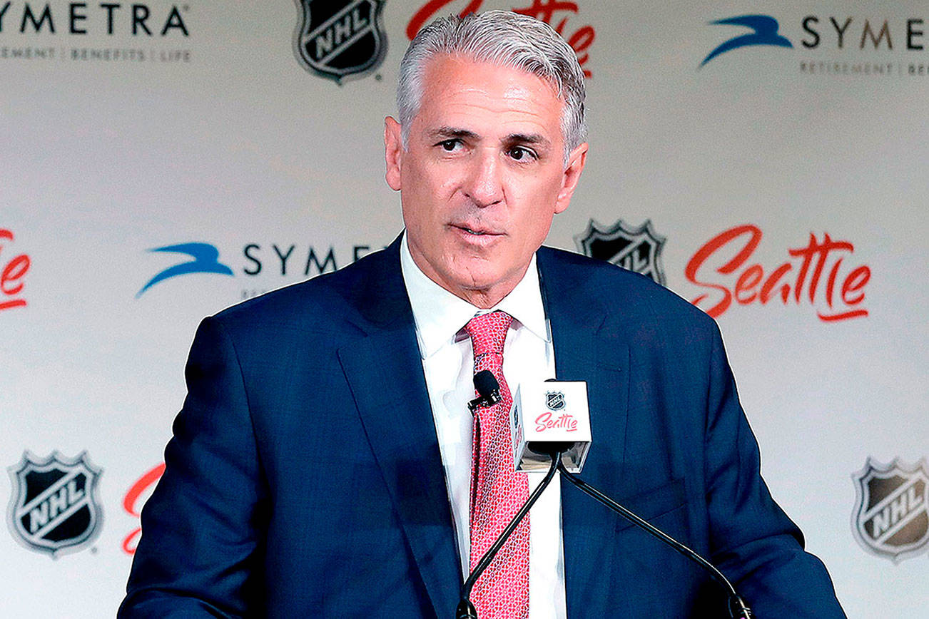 FILE - In this July 18, 2019, file photo, Ron Francis talks to reporters in Seattle, after he was introduced as the first general manager for Seattle's yet-to-be-named NHL expansion team. Scouts for Seattle's expansion NHL franchise have become a common sight at arenas around the league. In one corner of the second floor at the Seattle Kraken’s future training center sits the office of the general manager, complete with a view of the primary practice rink below. It’s a space Ron Francis will become very familiar with sometime in the summer of 2021 when that portion of the facility is completed.  (AP Photo/Ted S. Warren, File)