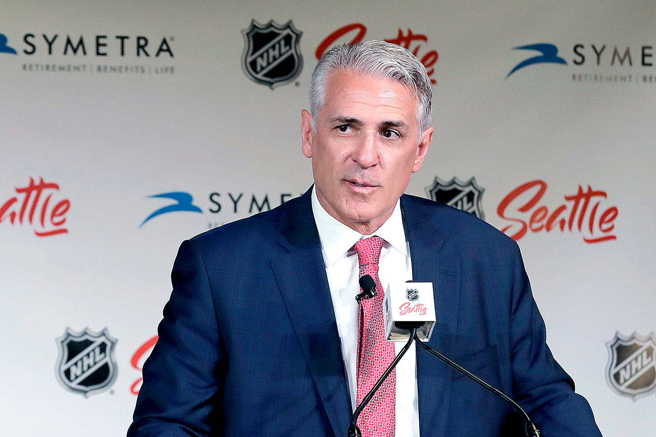 In this July 18, 2019, file photo, Ron Francis talks to reporters in Seattle, after he was introduced as the first general manager for Seattle’s yet-to-be-named NHL expansion team. Scouts for Seattle’s expansion NHL franchise have become a common sight at arenas around the league. In one corner of the second floor at the Seattle Kraken’s future training center sits the office of the general manager, complete with a view of the primary practice rink below. It’s a space Ron Francis will become very familiar with sometime in the summer of 2021 when that portion of the facility is completed. (Ted S. Warren/Associated Press file)