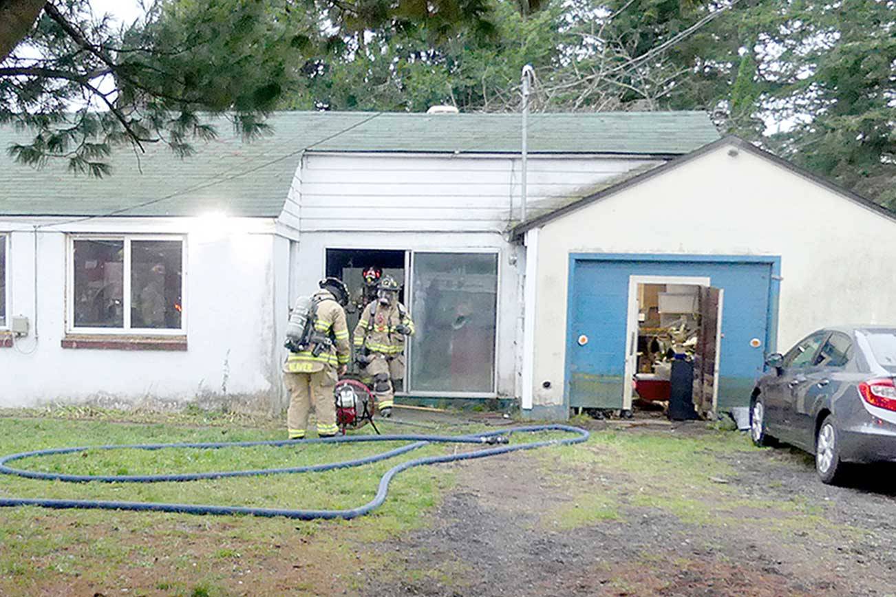 East Jefferson Fire Rescue personnel used a fire extinguisher to put out a fire in a small room inside a Port Hadlock home. (East Jefferson Fire Rescue)