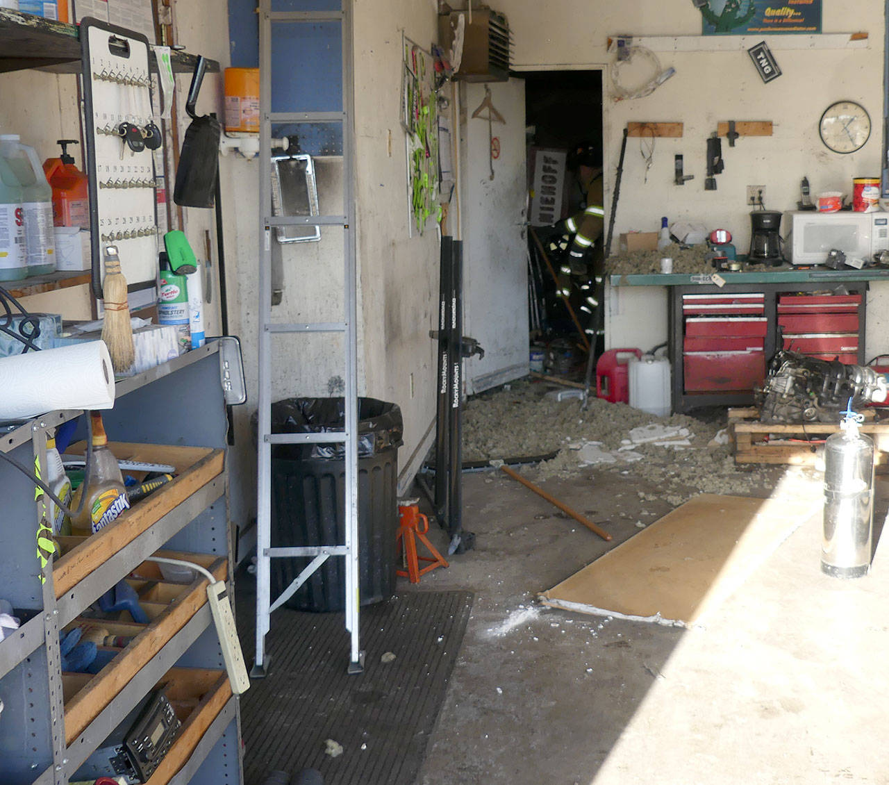 Owner Charles Gary and mechanic David Stratton extinguished an oil rag fire in this shop Tuesday, Dec. 22, 2020. (Courtesy photo)