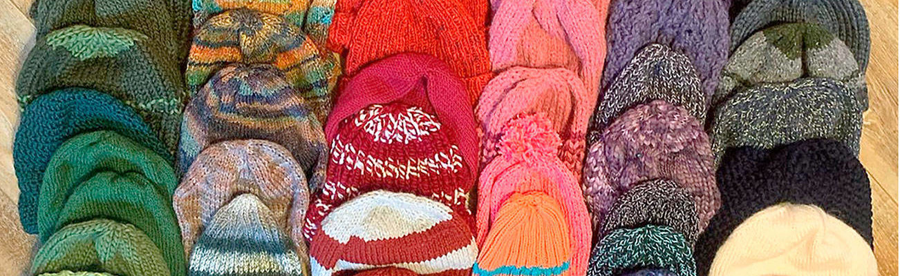 The Quilcene and Brinnon Community Knitters made 60 caps for workers of the Mason County and Jefferson County Public Utility Districts. (Photo courtesy of Lise Solvang)