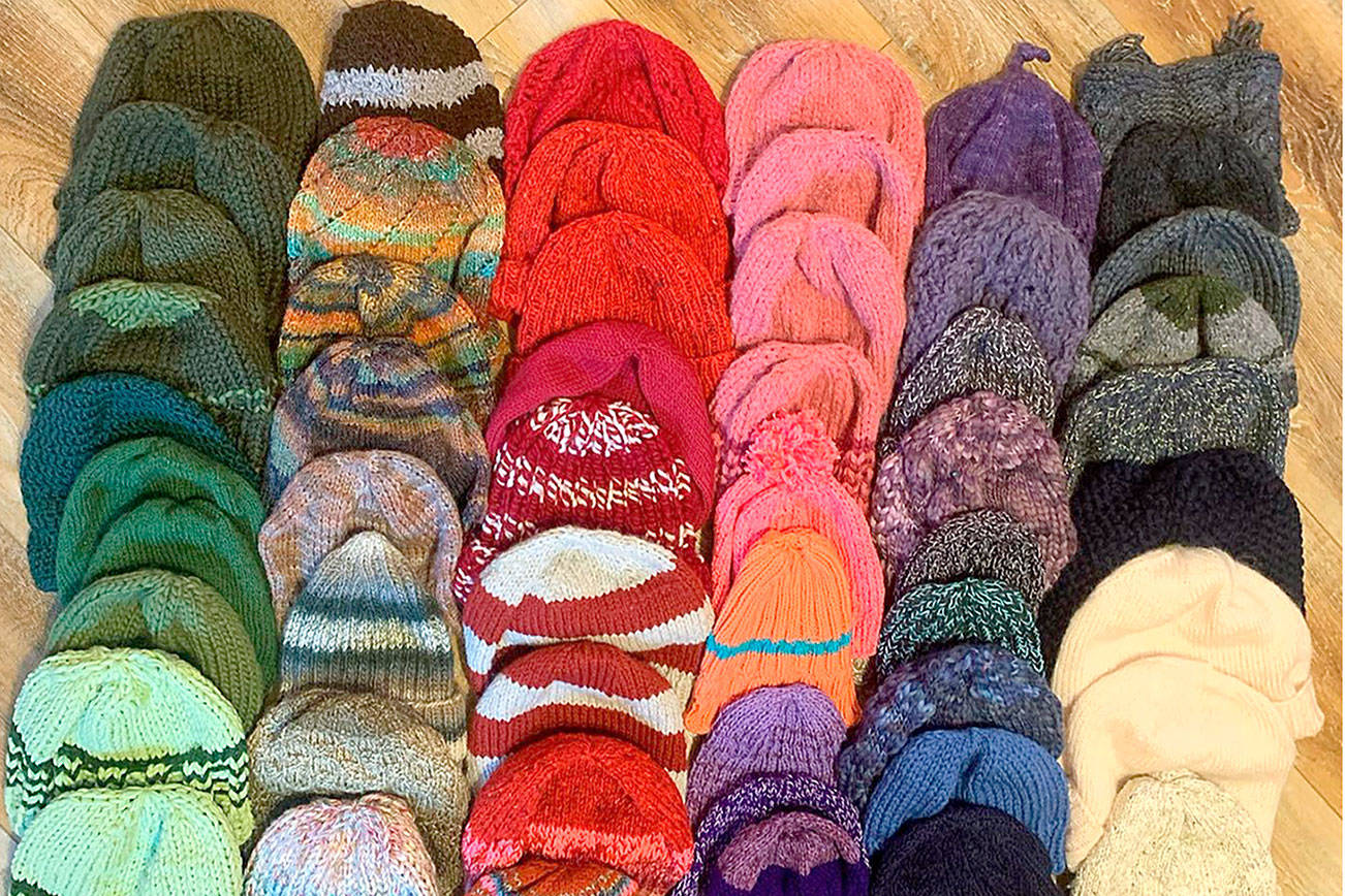 The Quilcene and Brinnon Community Knitters made 60 caps for workers of the Mason County and Jefferson County Public Utility Districts. (Photo courtesy of Lise Solvang)