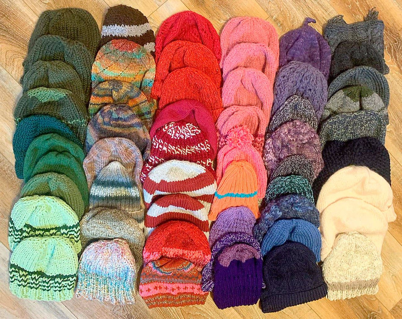 The Quilcene and Brinnon Community Knitters made 60 caps for workers of the Mason County and Jefferson County Public Utility Districts. (Photo courtesy of Lise Solvang)