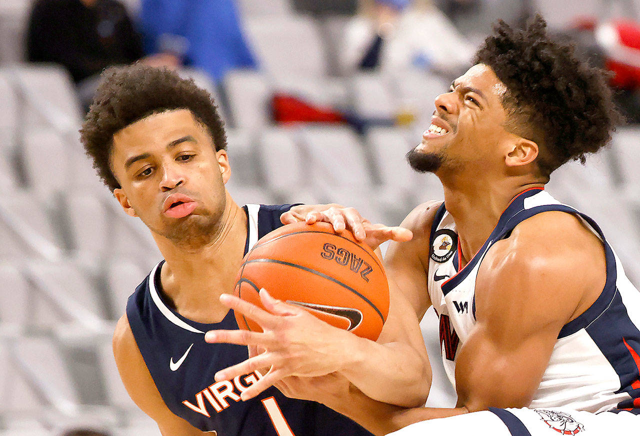 Virginia guard Jabri Abdur-Rahim (1) and Gonzaga guard Aaron Cook (4) wrestle for control of the ball during the second half of an NCAA college basketball game Saturday, Dec. 26, 2020, in Fort Worth, Texas. Gonzaga won 98-75. (AP Photo/Ron Jenkins)