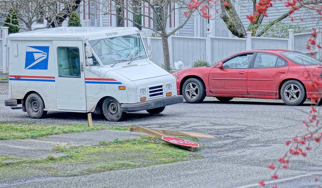 Wind snapped a stop sign post at Lawrence and Van Buren streets on Wednesday in Uptown Port Townsend. The powerful gusts knocked power out for nearly 1,000 Jefferson Public Utility District customers throughout the morning. (Diane Urbani de la Paz/Peninsula Daily News)