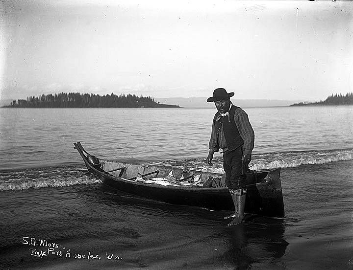 1917.115.16.jpg:  Makah Fisherman with a canoe full of halibut.   Photo by Samuel Morse c1902.   Washington State Historical Society.