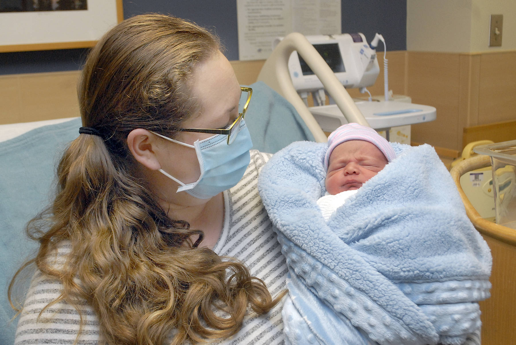 Keith Thorpe/Peninsula Daily News
Kaitlyn Loghry of Forks looks at her son, Ethan Scott Loghry, at Olympic Medical Center. The baby is named for his father, Scott Loghry, and grandfather.