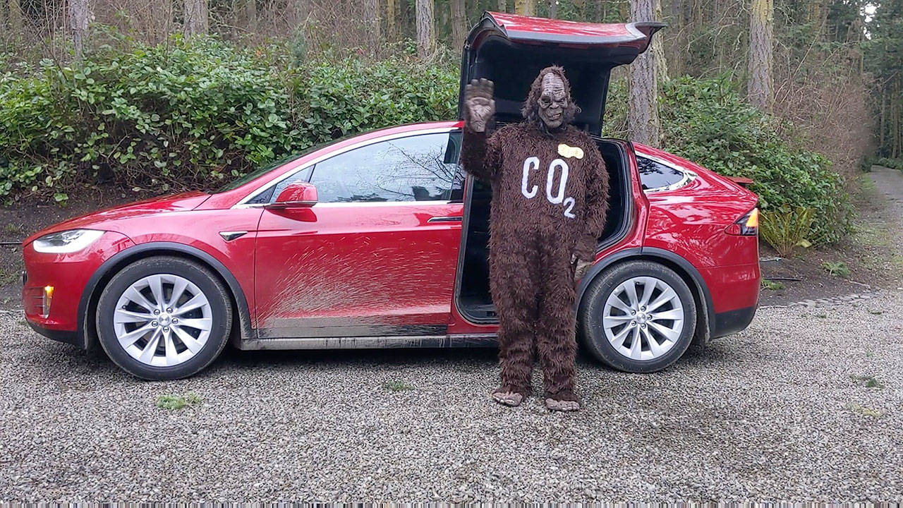 Bigfoot — aka Kepler Stanley-Hunt of Port Townsend — appeared recently with his family’s Tesla on McCurdy Point Road. More Bigfoot sightings are forecast as the Taming Bigfoot 2021: Recovering Greener challenge gets underway. (photo by Laura Tucker)