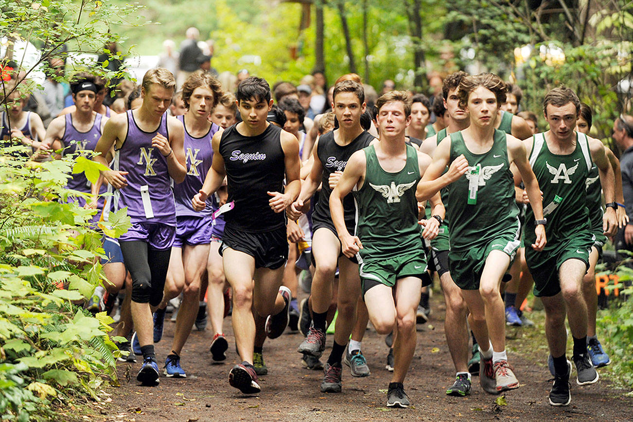Michael Dashiell/Olympic Peninsula News Group
Port Angeles, Sequim and North Kitsap boys runners are packed together at the start of Wednesday's cross country meet at Robin Hill County Park.
