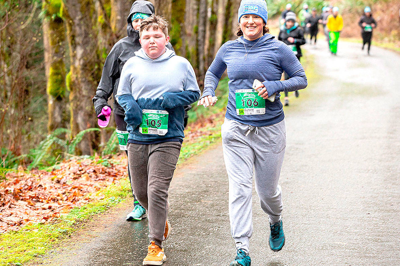 Run the Peninsula
Jensen Wolfe, left, and Michelle Turner lead the pack in the 2020 Elwha River Bridge Run. The 2021 race will have a number of COVID-19 precautions, including racers being encouraged to stay 6 feet apart.