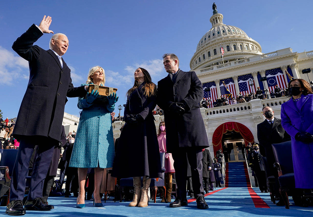 Joe Biden is sworn in as the 46th president of the United States by Chief Justice John Roberts as Jill Biden holds the Bible during the 59th Presidential Inauguration at the U.S. Capitol in Washington, Wednesday, Jan. 20, 2021, as their children Ashley and Hunter watch. (Andrew Harnik/The Associated Press)