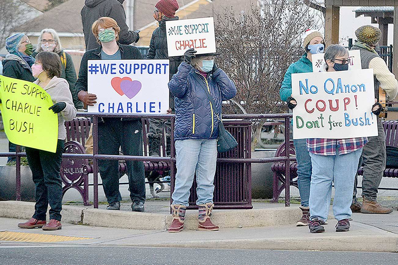 More than 100 community members rallied at the corners of Washington Street and Sequim Avenue on Monday afternoon holding signs to support Sequim City Manager Charlie Bush. The Sequim City Council was set to vote Monday night on Bush’s severance package after a majority of council members voted to call for his resignation on Jan. 11. (Matthew Nash/Olympic Peninsula News Group)