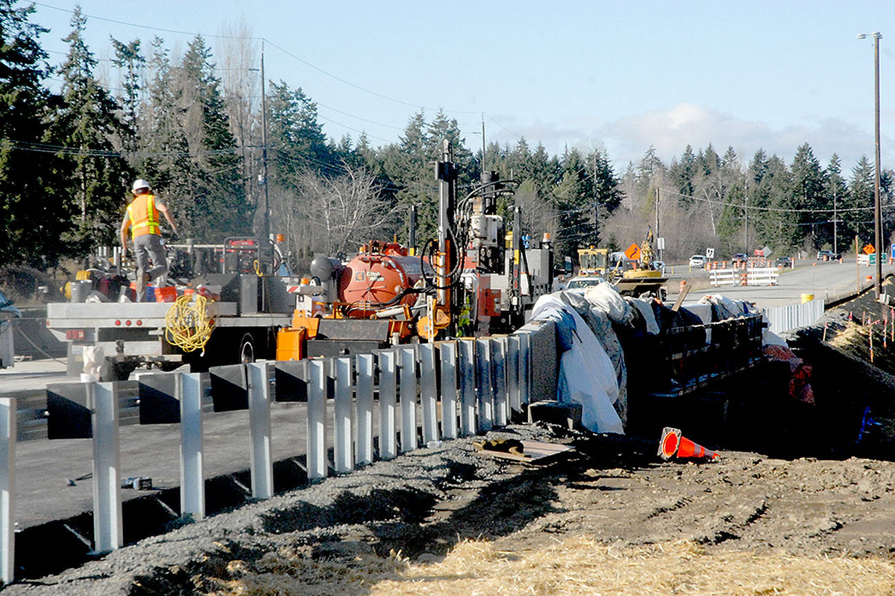 A construction crew readies a new bridge over Bagley Creek on the westbound lanes of U.S. Highway 101 east of Port Angeles on Wednesday. (Keith Thorpe/Peninsula Daily News)