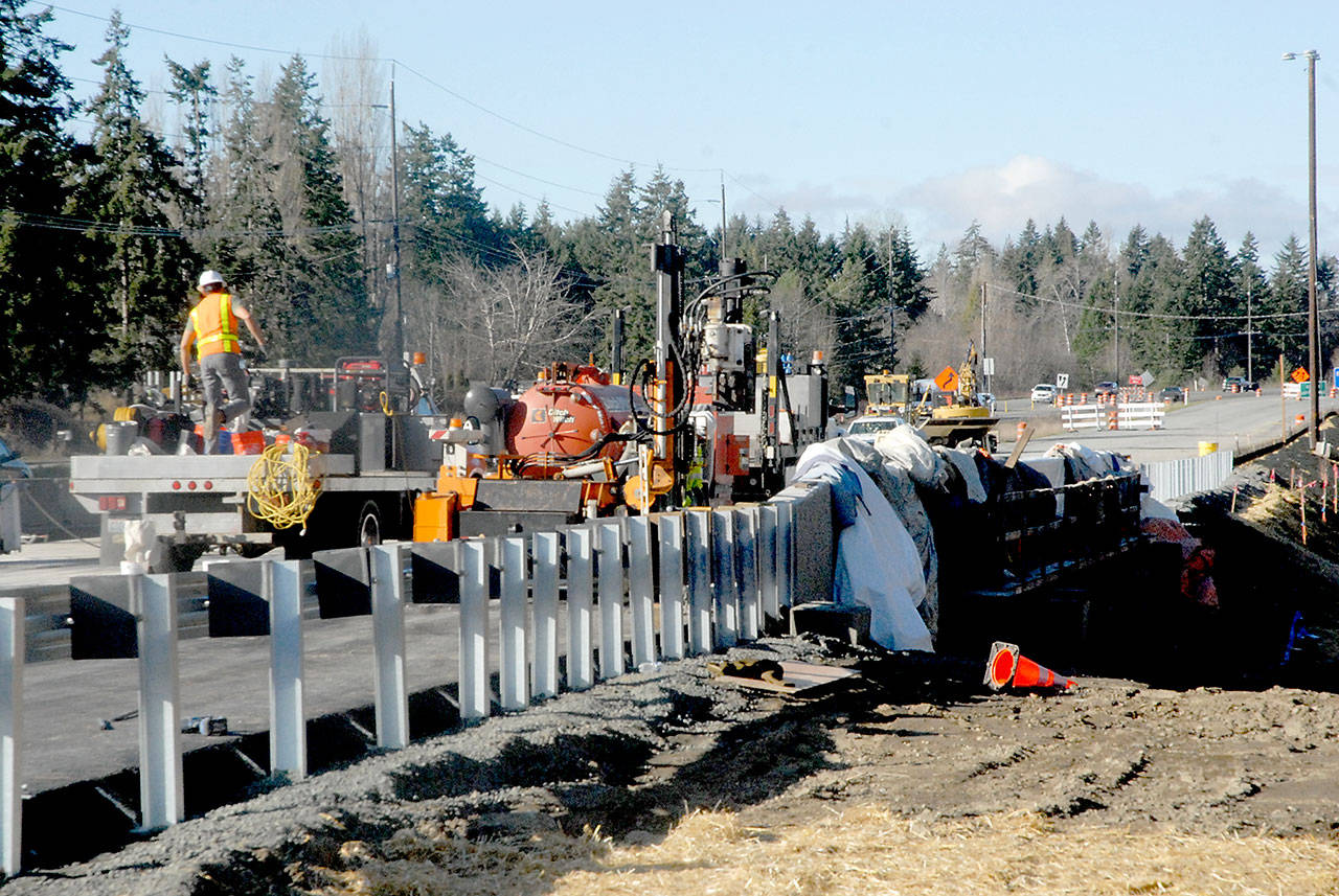 A construction crew readies a new bridge over Bagley Creek on the westbound lanes of U.S. Highway 101 east of Port Angeles on Wednesday. (Keith Thorpe/Peninsula Daily News)