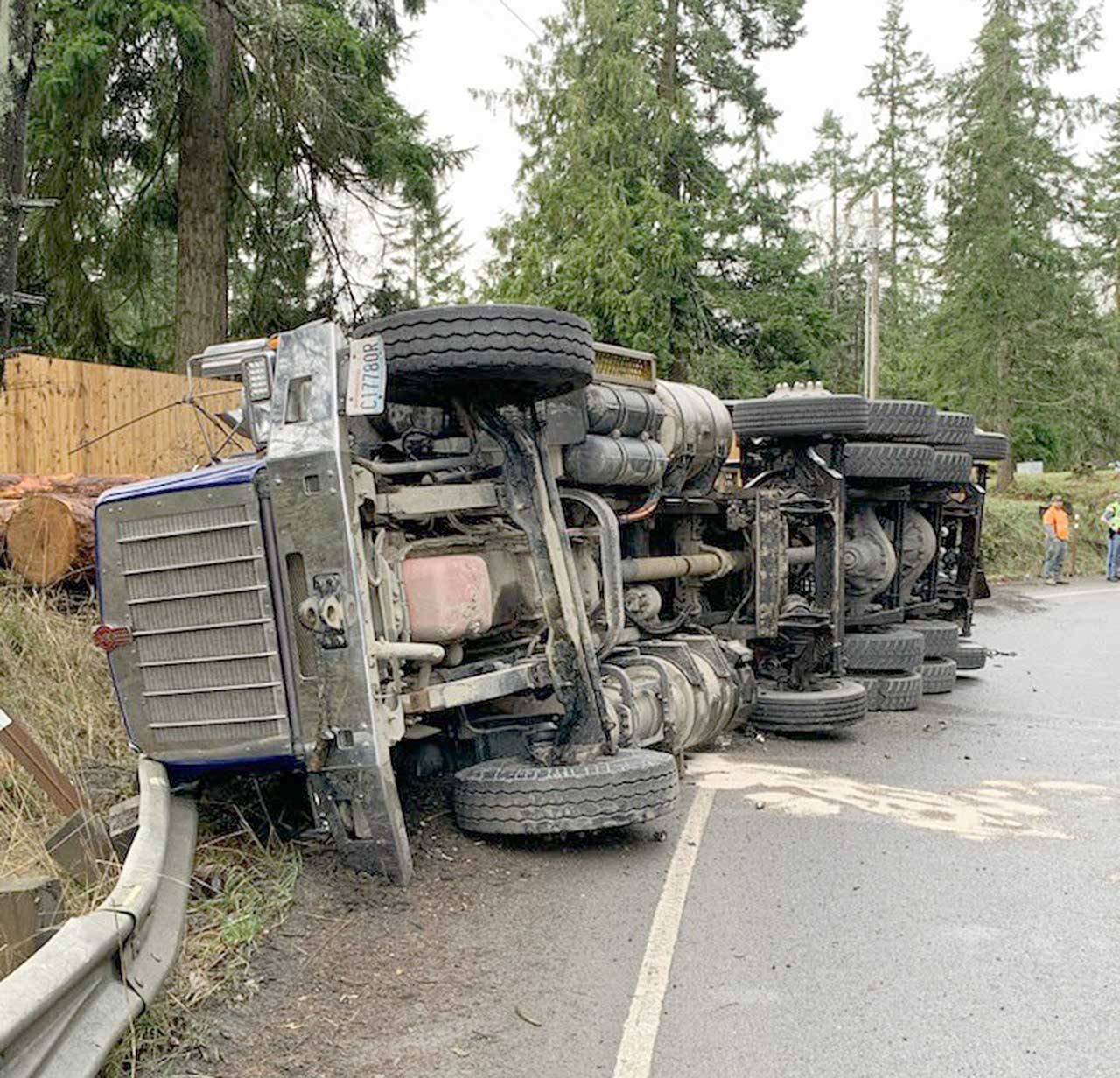 A log truck overturned on the exit from U.S. Highway 101 to state Route 117. (Washington State Patrol)